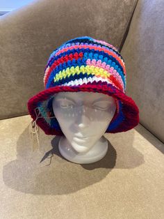 "hand made crocheted bucket/sun hat Size: 24\"-27\" Typical head circumference sizes: 21\" Xsmall 22\" Xs/Small 23\" Small/Medium 24\" Medium/Large 25\" Large/XL Material: 100% acrylic Wearable  Foldable for your purse  One of a kind hat Head Size in Inches Head Size in Centimeters American Hat Sizes   Head Size in Inches                          Head Size in Centimeters                            American Hat Sizes 19 3/8\"                                                 49.2 cm Adjustable Bucket Straw Hat For Beach, Multicolor Bucket Hat For The Beach, Multicolor Bucket Sun Hat For The Beach, Multicolor Bucket Hat For Beach, Adjustable Straw Bucket Hat, Knitted Beach Hat Made Of Yarn, Multicolor Crochet Hat With Short Brim, Hand Knitted Multicolor Crochet Hat In Cotton Yarn, Multicolor Knitted Crochet Hat In Cotton