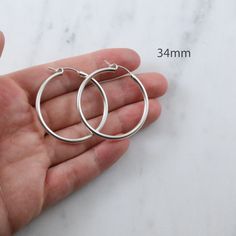 1 Pair Sterling Silver Thick Latch Click Hoops ✦ Quantity: 2 pieces (1 pair) ✦ Material: sterling silver ✦ Dimensions: 15mm, 18mm, 22mm, 34mm (2mm thick) ✦ Surface: shiny silver NO RETURNS ON EARRINGS - for sanitation reasons Ships next business day. ✦✦ SAVE 15% over $75+ CODE: SAVE15✦✦ Please let us know if you are interested in a higher quantity than what is currently listed. *International customers will be responsible for Import duties, taxes, since these are not included in the item price o Hypoallergenic Round Hoop Earrings For Everyday, Everyday Hypoallergenic Round Hoop Earrings, Cadmium-free Round Earrings For Everyday, Simple Nickel-free Round Hoop Earrings, Simple Round Hoop Earrings Nickel Free, Cadmium-free Hoop Earrings Gift, Nickel-free Minimalist Round Hoop Earrings, Minimalist Nickel-free Round Hoop Earrings, Thousand Oaks