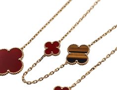 18k yellow gold Magic Alhambra 16 motif necklace by Van Cleef & Arpels, with carnelian and tiger's eye. Current retail $28000. Necklace comes in VCA pouch. DESIGNER: Van Cleef & Arpels MATERIAL: 18k Gold GEMSTONES: Tiger's eye, Carnelian DIMENSIONS: Necklace is 47.25" long. Clovers measure from 15 x 15mm to 25 x 25mm. MARKED/TESTED: VCA, 750, BL273***. WEIGHT: 62 grams CONDITION: Previously Owned, Excellent Condition. Elegant Carnelian Necklaces In Yellow Gold, Elegant Yellow Gold Carnelian Necklace, Luxury Red Necklaces, Elegant Carnelian Necklace With Polished Finish, Luxury Gold Carnelian Jewelry, Luxury Carnelian Jewelry For Formal Occasions, Elegant Brown Necklace With Polished Finish, Gold Carnelian Necklace For Formal Occasions, Luxury Brown Jewelry With Polished Finish