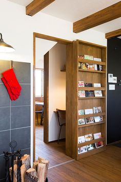 an open book shelf in the corner of a room