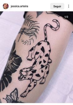 a tattoo on the leg of a person with a black and white dalmatian