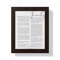 a framed paper with the word family on it