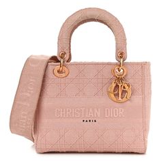 This is an authentic CHRISTIAN DIOR Canvas Embroidered Cannage Medium Lady D-Lite in Pink. This handbag tote is finely crafted of embroidered Cannage canvas with a 'Christian Dior' signature on the front and features fabric top handles and a shoulder strap with gold hardware, including a Dior letters charm. The top opens to a Dior monogram fabric interior with pockets. Luxury Double Handle Shoulder Bag With Embroidered Logo, Designer Embroidered Bags For Daily Use, Luxury Shoulder Bag With Embroidered Logo And Top Handle, Luxury Bags With Embroidered Logo For Daily Use, Luxury Shoulder Bag With Embroidered Logo For Daily Use, Elegant Top Handle Shoulder Bag With Embroidered Logo, Luxury Embroidered Top Handle Shoulder Bag, Designer Beige Shoulder Bag With Embroidered Logo, Luxury Beige Shoulder Bag With Embroidered Logo