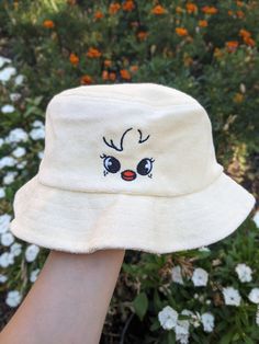 If you love Stray Kids and therefore Skzoo, this was made for you. Perhaps the CUTEST way to rep your bias in a subtle way. I love this bucket hat since it's made from 100% cotton terry cloth which gives it a trendy but still unique feel. If you have more than one bias (which who doesn't), or want to match with someone else, I do have the whole skzoo collection up in my shop! Most members I have as both a cap and a bucket hat, so whatever you need, I have covered.  This product is made especially for you as soon as you place an order, which is why it takes us a bit longer to deliver it to you. Making products on demand instead of in bulk helps reduce overproduction, so thank you for making thoughtful purchasing decisions! Adjustable Cute Cotton Bucket Hat, Funny White Hat As Gift, Funny White Hat As A Gift, Funny White Hat For Gift, Cute White Bucket Hat With Curved Brim, Cute White Bucket Hat, One Size, Cute Cream Hat For Gift, Cute Adjustable Bucket Hat, Cute White Brimmed Bucket Hat