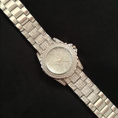 Stunning! Bold Rhinestone Encrusted Silver Watch! What A Statement Piece! Fits Up To A 8” Wrist, Has Removable Links For Size Adjustment. It’s Been Tucked Away In My Jewelry Armoire And Never Been Used... Just Needs A Battery. If You Are A Bling Queen, You Need This! Smoke Free. Elegant Iced Out Diamond Watch For Party, Silver Diamond Watch With Cubic Zirconia For Parties, Silver Cubic Zirconia Diamond Watch For Party, Diamond Watch With Rhinestones For Party, Silver Diamond Watch Iced Out For Party, Gift Watches With Crystal And Rhinestones, Silver Crystal Diamond Watch For Parties, Silver Diamond Watch With Rhinestones And Crystal, Silver Diamond Watch With Crystal For Parties