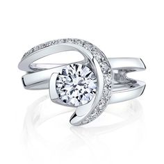 A fun fact about the Vision engagement ring is that it is the only Mark Schneider bridal style without a European squared shank. That being said, we can still make it with one if you would prefer. This ring is accented with 18 diamonds for a total weight of 0.245 carats. Your center stone is semi-bezel set at the same height as the accent diamonds that swoop around to hold it in place. The matching wedding band is set with 15 diamonds, for a total weight of 0.15 carats and it is unique because i Channel Set Diamond Engagement Ring, Yellow Gold Engagement Ring, Platinum Wedding, White Gold Wedding Bands, Rose Gold Wedding Bands, Yellow Gold Engagement, Gold Engagement Ring, The Vision, Channel Set