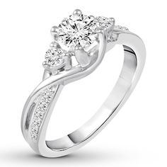 a white gold engagement ring with two diamonds