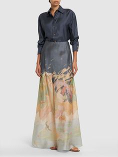 Concealed back zip closure. All over print placement may vary. Model is wearing a size0 Elegant Printed Skirt, Designer Fitted Silk Skirt, Formal Floral Long Skirt, Designer Silk Skirt, Organza Midi Skirt, Flare Maxi Skirt, Silk Midi Skirt, Printed Maxi Skirts, Floral Print Maxi