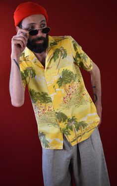 Presenting a cult Hawaiian Shirt made in Italy in the 89s. The typical palms, musicians, and dancer illustrations are placed on a beach and sea background in warm tones of yellow. Perfect for a cool summer outfit or for bringing the beach vibes into your daily life. Condition: Excellent Size: estimated M The model is 1.80m tall and is wearing size M. The shirt fits perfectly. Measurements: Shoulder 39cm Chest 50cm Length 70cm Materials: 65% cotton 35% polyester Collared Hawaiian Shirt With Palm Tree Print For Summer, Summer Collared Hawaiian Shirt With Palm Tree Print, Retro Multicolor Shirt For Vacation, Casual Vacation Shirt With Retro Print, Summer Retro Print Shirt With Camp Collar, Retro Beach Shirt For Spring, Retro Printed Relaxed Fit Camp Shirt, Retro Printed Camp Shirt With Relaxed Fit, Summer Collared Camp Shirt With Palm Tree Print