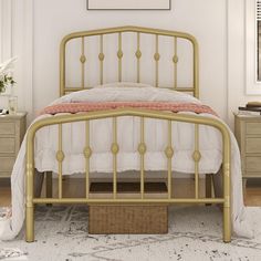 a gold metal bed frame in a white bedroom