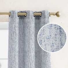 a curtain with a blue and white pattern on it