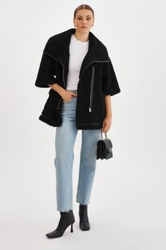 Make a statement with the Ohanna Faux Fur Coat. With its asymmetrical front zip closure and 3/4 sleeves, this coat adds a touch of elegance to any casual outfit. Versatile to style, it can be layered over a leather jacket, or worn with long leather gloves. Long Leather Gloves, Sherpa Coat, Black Xs, Faux Fur Coat, Leather Gloves, Black Coat, Casual Outfit, Snug Fit, Fur Coat