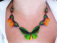 Butterfly Necklace Pretty Summer Green Red and by whatanovelidea, $38.00 Multicolor Butterfly Charm Necklaces, Multicolor Butterfly Charm Jewelry, Multicolor Butterfly Jewelry For Gifts, Multicolor Butterfly Jewelry Gift, Unique Multicolor Butterfly Jewelry, Multicolor Butterfly Print Jewelry Gift, Elegant Multicolor Butterfly Necklace As A Gift, Elegant Multicolor Butterfly Necklace As Gift, Elegant Multicolor Butterfly Necklace Gift