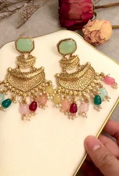 This stunning Bollywood inspired  dangling earrings perfect for any special occasion. mint and gold finish combination with bead and stones , both adorned with intricately detailed  work. The jewelry is handmade in India with gold plating on a brass base metal.  This trendy jewelry set is a true work of art and features adjustable features for your convenience. It is perfect for engagement, wedding, or anniversary events and will add a touch of glam to any outfit. Don't miss out on this unique a Bohemian Bridal Earrings With Intricate Design, Festive Bohemian Jeweled Earrings, Gold Beaded Earrings For Festivals And Parties, Gold Beaded Earrings For Party And Festivals, Jeweled Drop Chandelier Earrings For Festivals, Festive Green Bohemian Earrings, Gold Bohemian Chandbali Chandelier Earrings, Gold Jeweled Chandelier Temple Earrings, Green Temple Jewelry Style Chandelier Earrings For Celebration