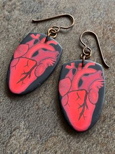 These earrings are made from slices of a complex polymer clay cane depicting an anatomical heart. They are completely hand made by me. They are finished with hypoallergenic niobium earwires. The default colour for the earwires is brown, but leave me a note if you want me to switch this to another colour (pink, or yellow).  I shape each slice individually so there will be slight variations for each piece. Normally I mirror earrings, but for these I have left them both the same (which is the way t Mirror Earrings, Clay Cane, Polymer Clay Cane, Anatomical Heart, You Want Me, Heart Earrings, Made By Me, Favorite Jewelry, Jewelry Earrings Dangle