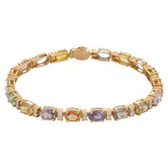 Bracelets are worn to enhance the look. Women love to look good. It is common to see a woman rocking a lovely gold bracelet on her wrist. A gold gemstone bracelet is the ultimate statement piece for every stylish woman. Adorn your wrist with this beautiful multi-sapphire and diamond prong set charm bracelet in 14 Karat Gold. Each piece is handmade with a unique shape of precious stone. This elegant and lightweight bracelet is perfect for everyday wear. PRODUCT DETAILS :- Material - 14K Solid Yel