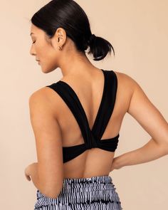 Black Switch V Crop – Nani Swimwear Beach Activewear With Built-in Bra And 4-way Stretch, Workout Top With Built-in Bra, Triangle Shape, Black Triangle Top Sports Bra With Built-in Bra, Black Seamless V-neck Sports Bra, Black Sports Swimwear With Built-in Bra, Comfortable V-neck Crop Top For Yoga, Athleisure Crop Top With Built-in Bra For Beach, V-neck Crop Top, Bra Friendly For Yoga, V-neck Bra-friendly Crop Top For Yoga