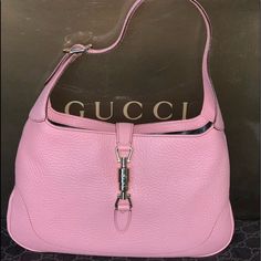 New With Tags & In Gucci Box Gucci Jackie Medium Hobo Shoulder Bag Light Pink Leather Classic And Stylish Perfect For Any Occasion The Timeless Design Is Made Of Pink Pebbled Leather With Golden Tone Hardware. The Single Strap Is Adjustable And Is Adorned With A Golden Buckle On The Side. A Signature Golden Tone Piston Push Clasp Opens To Reveal An Interior Lined In Black Leather With One Zipped Pocket. Made In Italy Measurements: 13”L X 8” H X 1 ½”D Adjustable Strap Drop: 8”-9” Pink Gucci Bag With Branded Hardware, Luxury Pink Shoulder Bag With Palladium Hardware, Elegant Pink Shoulder Bag With Silver-tone Hardware, Designer Pink Shoulder Bag For Formal Occasions, Pink Gucci Bag With Gold-tone Hardware, Designer Pink Bag For Formal Occasions, Gucci Pink Luxury Shoulder Bag, Pink Gucci Luxury Shoulder Bag, Gucci Luxury Pink Shoulder Bag