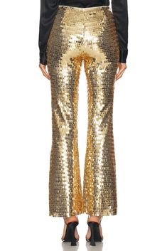 Self 1 & Lining: 100% polyester, Sequin: 100% polyethylene terephthalate.  Made in China.  Spot clean only.  Hidden side zipper closure.  High-waist fit.  Sequin embellished fabric.  .  .  .  .  .  .  .  .  .  . Sequins Pants, Sequin Pant, Embellished Fabric, Simon Miller, Polyethylene Terephthalate, Gold Stars, Metallic Gold, Side Zipper, Metallic Silver