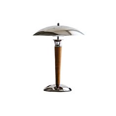 a lamp that is on top of a metal stand with a wooden pole underneath it