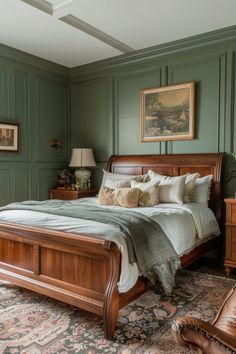 a bedroom with green walls and furniture in the corner, including a large wooden bed