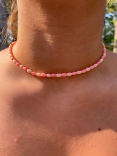 This beautiful necklace is made of natural coral beads. The color of the beads varies with different shades and patterns of pink. For cool summer fun or cozy winter warmth, coral bead necklace will be just the right addition to your look. The beads are 6x4mm The necklace is presented with a lobster claw clasp, and a 2 inch extension that makes it easy to adjust the size. **Sterling silver option does not have an extension chain** *We do welcome wholesale requests for your special occasion or for Tiny Necklace, Coral Beads Necklace, Graduation Jewelry, Natural Coral, Pearl Choker Necklace, Coral Necklace, Cool Summer, Coral Beads, Pearl Choker