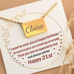 a birthday card with a gold square pendant on it