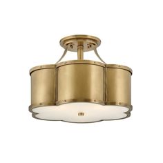 a semi flush ceiling light in an antique brass finish