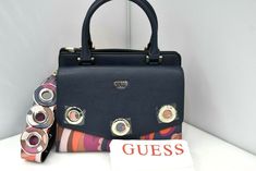 New GUESS Dinah Paisley Shoulder Bag $110 PP679105 Handbag   Width: 11.0" Height: 9.0" Depth: 5.5"  Removable multicolor strap with 11.0" drop. Handles with 5" drop. **All measurements are approximate** Free shipping within US. International shipping though Global Shipping. Returns are accepted, the customer pays the return shipping cost. The item has to be in original condition with all plastics, protectors, accessories and tags as well. Please contact us with any question before purchasing. Designer Satchel With Branded Hardware For Shopping, Handheld Satchel With Branded Hardware For Shopping, Handheld Satchel For Shopping With Branded Hardware, Designer Multicolor Satchel For Shopping, Multicolor Top Handle Bag With Branded Hardware, Handheld Satchel Fashion Accessory, Multicolor Shoulder Bag With Branded Hardware For Everyday Use, Travel Bags With Branded Hardware In Multicolor, Multicolor Travel Bags With Branded Hardware