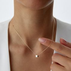 14K Solid Gold Little Gold Vermeil Cube Necklace Elevate your style with our 14K Solid Gold Little Gold Vermeil Cube Necklace - a dainty and minimalist piece that adds a touch of elegance to any outfit. This geometric necklace features a petite cube charm, expertly crafted from high-quality gold vermeil, offering a chic and timeless look. Details: Material: 14K Solid Gold Pendant: Gold Vermeil Cube Chain Length: Varies Style: Minimalist, Geometric, Dainty Perfect for layering or wearing alone, t Delicate Yellow Gold Necklace With Square Pendant, Delicate Yellow Gold Square Pendant Necklace, Modern 14k Gold Necklace With Delicate Chain, Modern 14k Gold Square Pendant Jewelry, Modern 14k Rose Gold Necklaces, Modern 14k Gold Necklace For Everyday, Minimalist 14k Yellow Gold Necklace, Delicate Square Pendant Necklace For Everyday, Everyday Rose Gold Necklace With Square Pendant