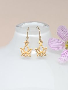 Our gift to you 10% off your first purchase. Details here - http:/eepurl.com/dpVPBz Dainty and tiny lotus flower earrings Definitely the perfect little earrings DETAILS 14 k gold fill ear wires or sterling silver ear wires The dainty lotus charm is made of the highest quality 24 k gold plate or sterling silver Total length from top of ear wire to bottom of lotus is 20 mm Lotus flower charm is 10 mm long These earrings are sold as a pair All earrings are non refundable, returnable or exchangeable Om Spiritual, Gold Lotus Flower, Lotus Necklace, Lotus Earrings, Gold Lotus, Cz Earrings, Flower Tops, Spiritual Gifts, Butterfly Earrings