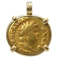 The first of its kind in my shop, a Roman gold Aureus. I cannot find any online shop that sells these set in gold. I see lots of seller charging what I charge for trivial coins (bronze, not gold and large like this one). This stunning coin measures about 19 mm and weighs nearly 7 grams. To appreciate the pendant's size, the relief of the coin and the shape of the bail, see the picture showing the coin next to a US quarter. The coin was first set in a 18k gold bezel, which was then hammered over the edge of both sides. This was then sanded and polished. This pendant is built to last. The pendant feels incredible in hand. The pendant will come with a pendant box and coin information. Bought from a coin dealer in the Netherlands, found in a France. -- Coin information: Nero, gold aureus. Stru Goddess Of Health, Coin Dealers, Gold Coin Necklace, Gold Coin, Laura Lee, Coin Necklace, Gold Coins, Jewelry Necklace Pendant, 18k Gold