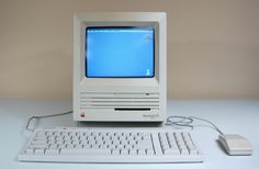 an old computer with a keyboard and mouse