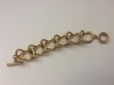 "Givenchy brushed gold, matte gold, satin gold twisted wire link bracelet Very good condition size - 7.5\" with clasp x 1\"" Metal Link Bracelets With Gold Clasp, Gold Chain Link Bracelet With Clasp, Gold-tone Metal Chain Bracelet With Lobster Clasp, Formal Brass Bracelets With Lobster Clasp, Formal Metal Chain Bracelet With Gold Clasp, Metal Chain Bracelet With Gold Clasp For Formal Occasions, Adjustable Chain Link Gold-tone Bracelet, Formal Chain Bracelet With Gold Clasp, Formal Gold-tone Metal Bracelets