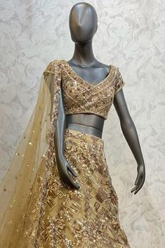 Description : This Lehenga Choli is Ready to Wear Golden attached cancan lehenga with sequin, floral embroidery. Paired with a padded blouse with all over beads, sequins, thread work and dupatta. Details : No of Components: 3 Components: Blouse, Dupatta, Lehenga Pattern: Embroidery Type of Work: Sequins, & Thread Work Neckline: Sweetheart Neck Sleeve Type: Sleeveless Fabric: Net Color: Golden Other Details: Attached inner lining Lehenga Length: 46.5 inches Blouse Chest : 36 Occasion: Bride, Dest Party Wear Art Silk Lehenga With Intricate Embroidery, Party Wear Lehenga With Intricate Embroidery In Art Silk, Party Wear Choli In Art Silk With Intricate Embroidery, Unstitched Embellished Choli With Traditional Drape, Festive Embroidered Chinon Lehenga, Diwali Traditional Wear In Art Silk With Sequins, Party Embellished Embroidered Art Silk Fabric, Party Wear Art Silk Sequins Set, Party Wear Sequin Art Silk Sets