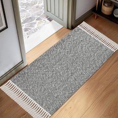 a rug on the floor in front of a door