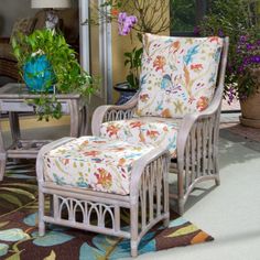 a chair and ottoman on a patio with potted plants