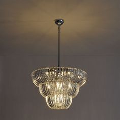 a chandelier hanging from the ceiling in a room