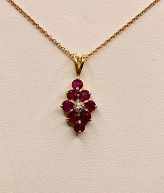 Beautiful Vintage 14k Yellow Gold Natural Rubies Pendant 100% Genuine Ruby Rubies 1.00CT Diamond(s) 0.01CT Color: F Clarity: SI2 Total Pendant Weight: 1.2GR 14K Yellow Gold No Chain Necklaces and chains available upon special request For more information regarding this item feel free to reach me so I can accommodate your needs. Thank you Classic Yellow Gold Ruby Necklace, Classic Ruby Necklace In Yellow Gold, Yellow Gold Ruby Necklace With Diamond Cut, Formal Yellow Gold Necklace With Ruby, Formal Yellow Gold Ruby Necklace, Yellow Gold Ruby Necklace With Prong Setting, Classic Red Diamond Necklace For Anniversary, Classic 14k Gold Hallmarked Diamond Necklace, Exquisite 14k Gold Necklace With Prong Setting