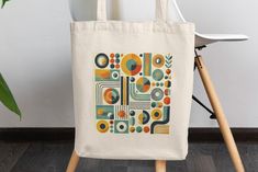 Elevate your style with this stunning midcentury modern shoulder bag! 🌟✨ Featuring a bold and colorful geometric design, this retro 70's inspired tote is perfect for the chic, boho-loving girlfriend in your life. Its unique pattern makes it a standout piece, ideal for carrying your favorite books or essentials while adding a touch of vintage charm to your outfit. Whether you're heading to the market, a casual outing, or a summer adventure, this shoulder bag combines practicality with eye-catchi Retro Everyday Rectangular Shoulder Bag, Retro Rectangular Shoulder Bag For Everyday, Retro Crochet Shoulder Bag, Retro Everyday Shoulder Bag, Retro Flap Shoulder Bag, Retro Shoulder Bag For Everyday Use, Square Retro Shoulder Bag, Retro Square Shoulder Bag For Everyday, Mid-century Rectangular Shoulder Bag For Daily Use