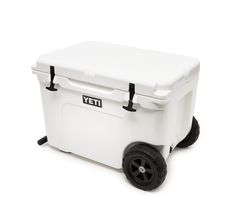 the yeti wheeled cooler is white and has black wheels