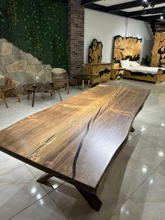 a large wooden table sitting on top of a tiled floor