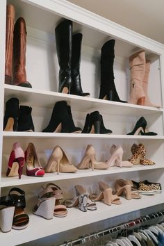 there are many pairs of shoes on the shelves