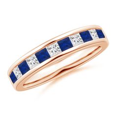 a yellow gold ring with blue and white diamonds