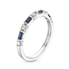 a white gold ring with blue sapphire stones