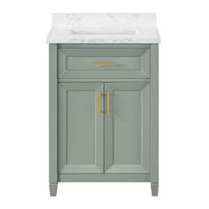 a bathroom vanity with a marble top and gold handles on the door, in grey