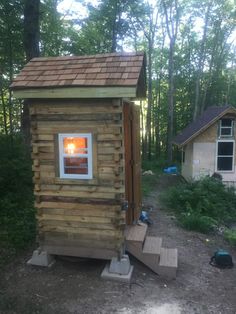 a small house made out of wooden boards