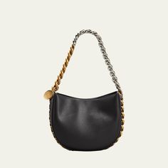 Stella McCartney shoulder bag in faux-leather. Two-tone chain shoulder strap woven onto bag; hanging engraved charm. Detachable, adjustable shoulder strap, 22.6" drop. Open top with snap closure. Interior, one slip pocket. Approx. 6.9"H x 8.5"W x 2.8"D. Item weighs approx. 1.9 lb. "Frayme" is made in Italy. Luxury Everyday Bags With Chain Detail, Luxury Shoulder Bag With Chain In Crossbody Style, Luxury Everyday Bags With Chain, Luxury Chain Crossbody Shoulder Bag, Luxury Chain Shoulder Bag Crossbody, Luxury Chain Shoulder Crossbody Bag, Top Handle Bag With Chain For Everyday Use, Evening Crossbody Hobo Bag With Metal Hardware, Evening Hobo Crossbody Bag With Metal Hardware