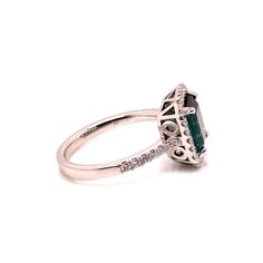 Introducing a stunning Brazilian Green Tourmaline and Diamond Dinner Ring, a timeless piece that exudes elegance and sophistication. This exquisite ring features a gleaming emerald-cut bluish-green Tourmaline, measuring 8.25 x 7.5 MM and weighing an estimated 2 carats. The center stone is beautifully enhanced by a dazzling pave diamond halo (estimated 0.35 carat total weight), with G/H color and SI2 clarity, and additional diamonds adorning the shank. Set in a handcrafted 14K white gold setting, this ring is a size 6.5 (no alterations by the seller).  Tourmaline is a gemstone of extraordinary color, often mistaken for rubies or emeralds before being officially recognized in the 1800s. Few gems can match Tourmaline's vibrant spectrum, with each color holding unique symbolism. Green Tourmali Classic Emerald Cut Gemstone Halo Ring, Elegant Green Sapphire Ring Gia Certified, Formal Emerald Halo Ring Fine Jewelry, Formal Emerald Cut Sapphire Ring With Halo Setting, Formal Emerald-cut Sapphire Ring With Halo Design, Formal Gia Certified Green Sapphire Ring, Formal Emerald-cut Sapphire Ring With Halo Setting, Gia Certified Green Sapphire Ring For Formal Occasions, Formal Radiant Cut May Birthstone Ring