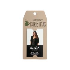 a christmas tag with a woman's face on it and the words merry christmas